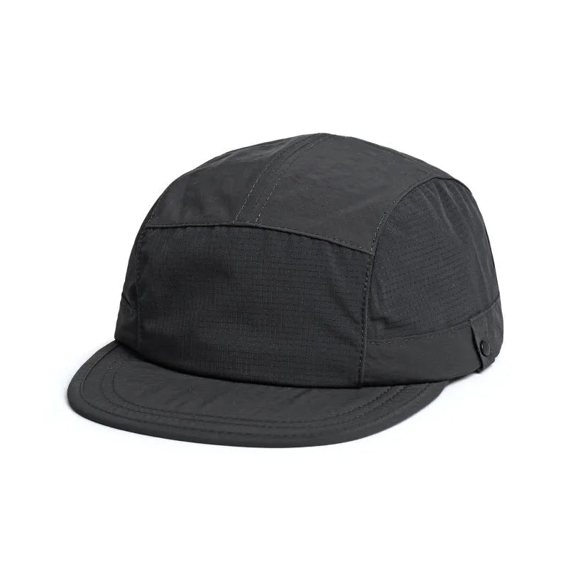 Dome crown summer cap in grey with mesh side panels and a soft, extended fabric peak for sun protection.