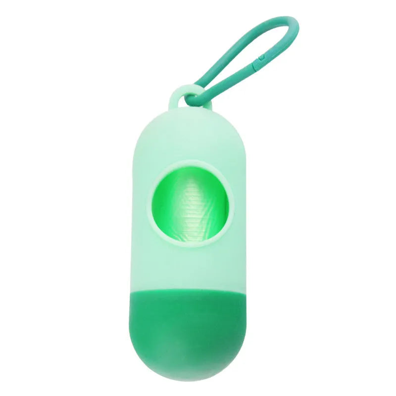 Black dog poop bag holder with side hook and Velcro closure, showing compact size.