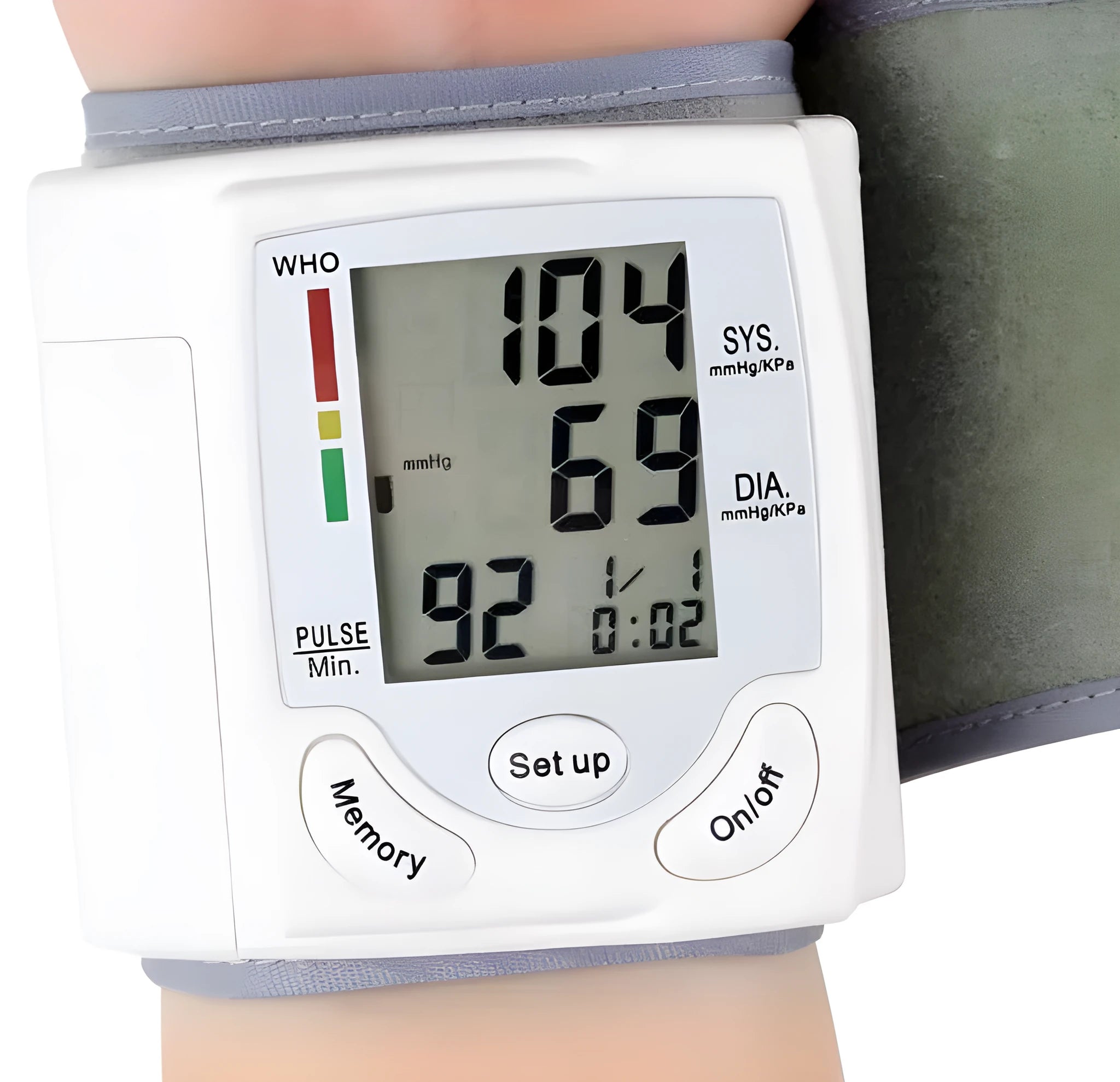 Grey portable wrist blood pressure monitor with digital display on a wrist.