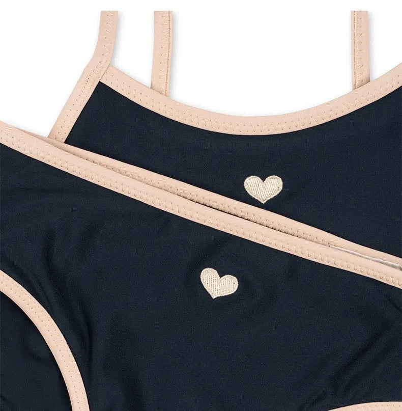 Dark blue split colour baby girl's swimsuit with briefs and split design for swimming.