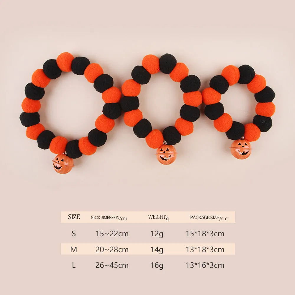 Orange Halloween cat collar with a pumpkin graphic and text, showing the adjustable clasp.