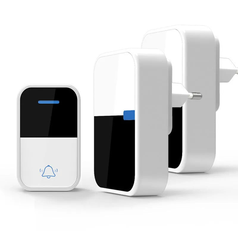 White wireless doorbell kit with plug-in chime and push button on a wooden table
