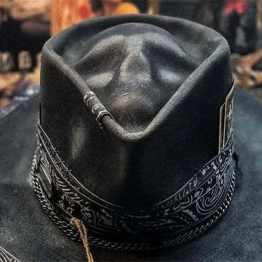 Handmade black wool felt skull hat with a tall pointed conical crown for Halloween costumes.