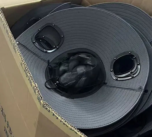 Man's grey solar fan cap with large brim and a small solar panel and fan visible on the front.