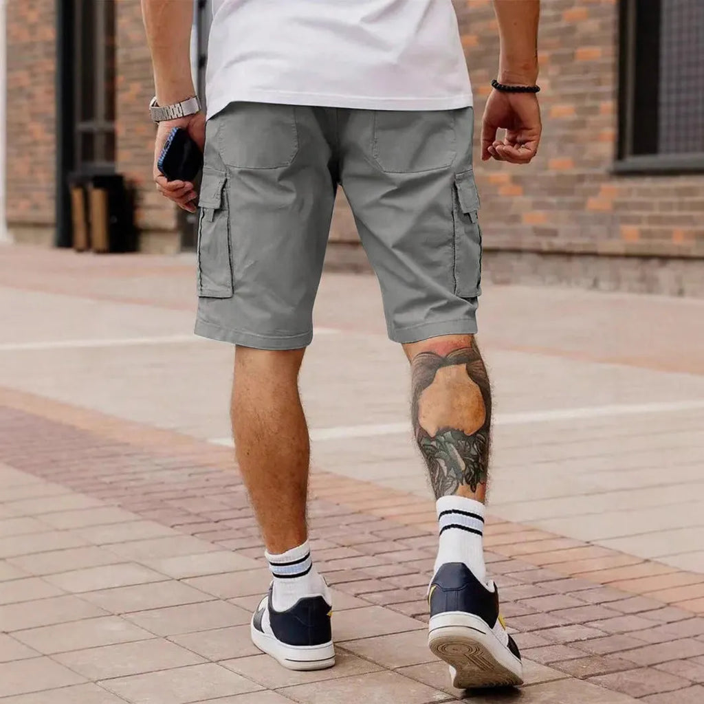 Men's straight-leg cropped workwear shorts in army green, showcasing loose fit and summer casual style.