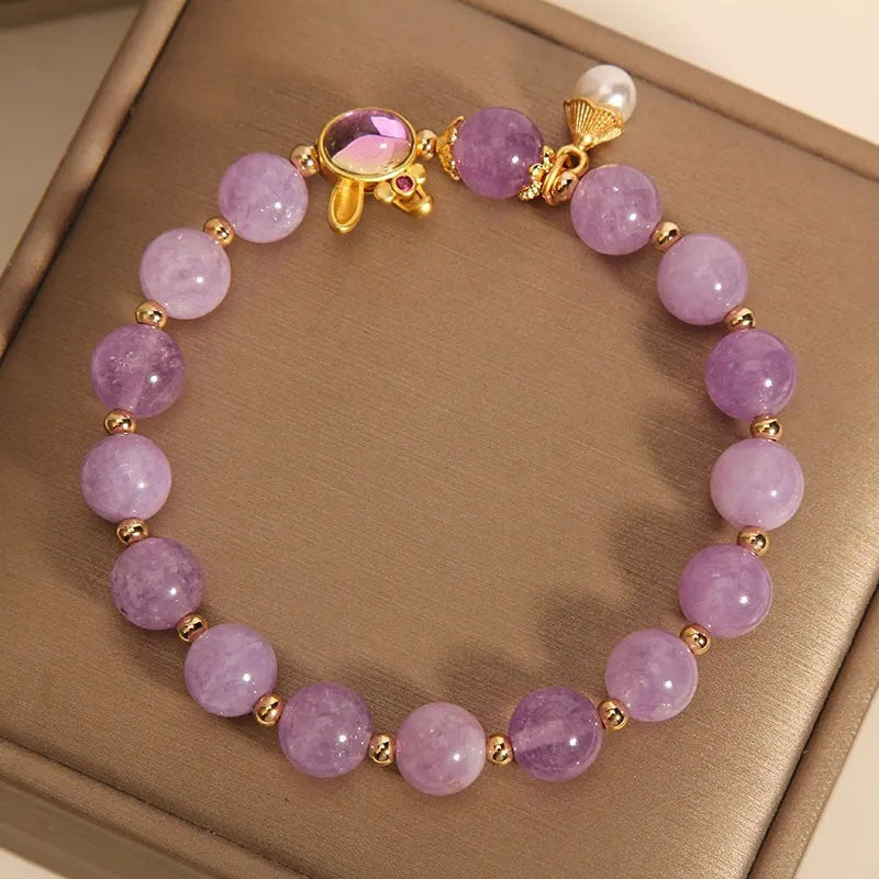 Mauve jade hare head pendant on a clear crystal bracelet, Mori style design.