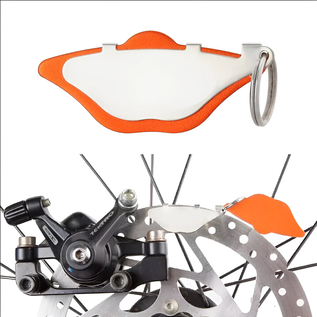 Mountain bike disc brake pads in black and orange with scratch-proof design