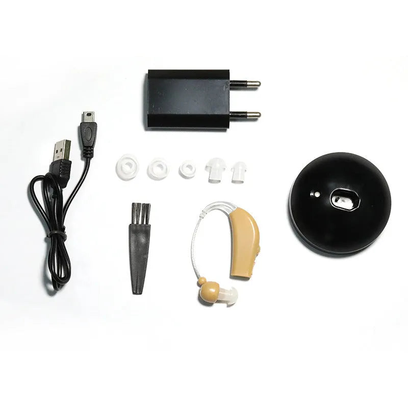 Black rechargeable hearing aid amplifier with silicone ear tips for elderly users