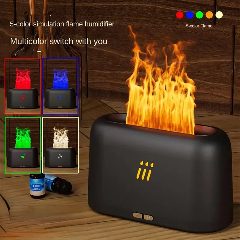 Black round flame aroma diffuser and humidifier with LED lights on a table.
