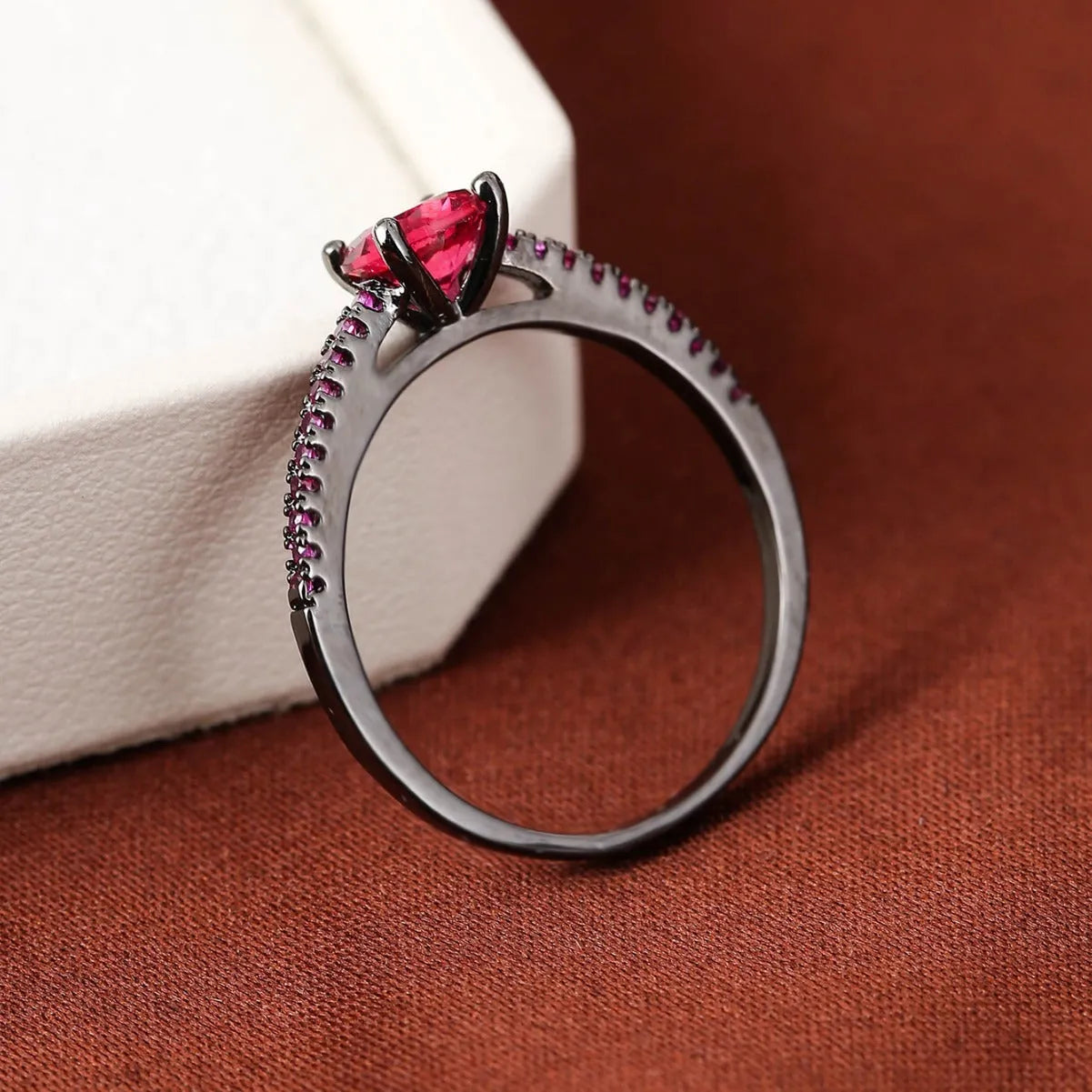 Geometric hexagonal cubic zirconia ring with electroplated copper band in a choice of ten colours.