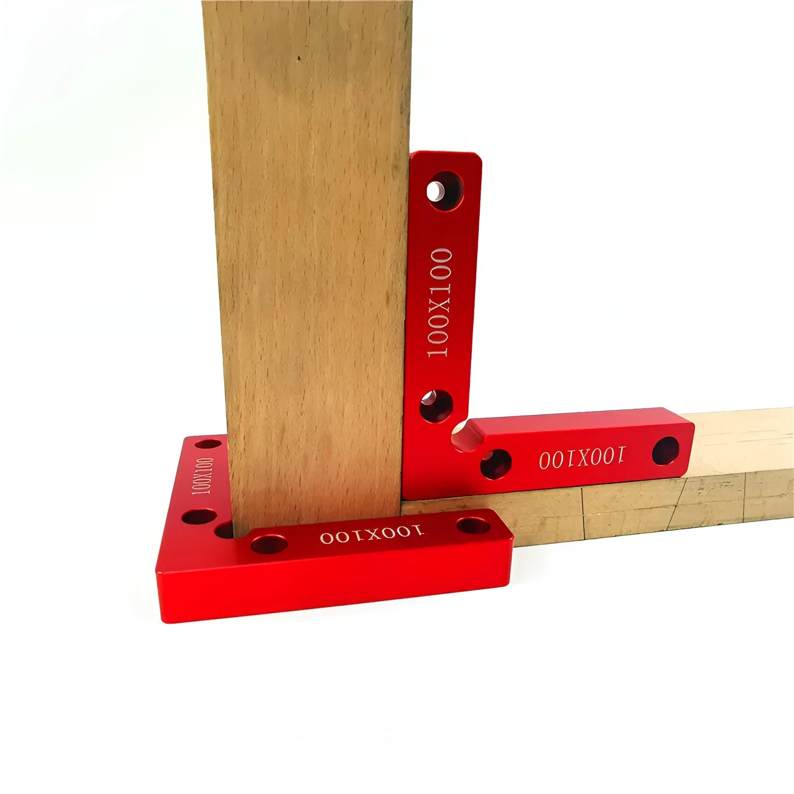Aluminium woodworking right angle positioning block with engraved scale, shown next to a clamp.