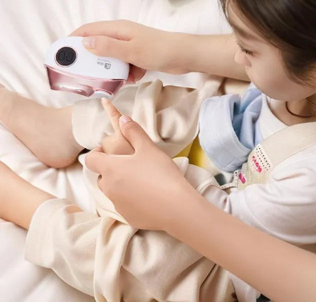 Blue rechargeable electric nail clipper and polisher with cleaning brush and USB cable.