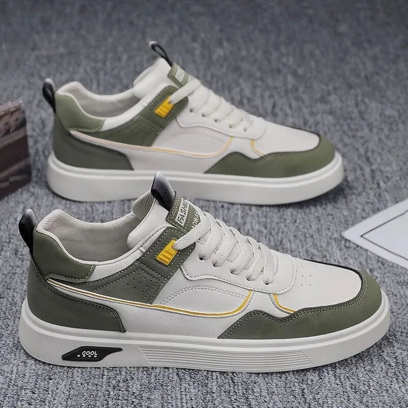 Men's low-top canvas board shoes in grey with leather stitching detail on a white background.