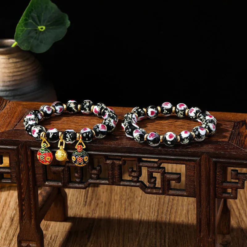 Handmade heart-shaped glass bracelet with swallowing gold beast pattern in ancient fluorescent glaze