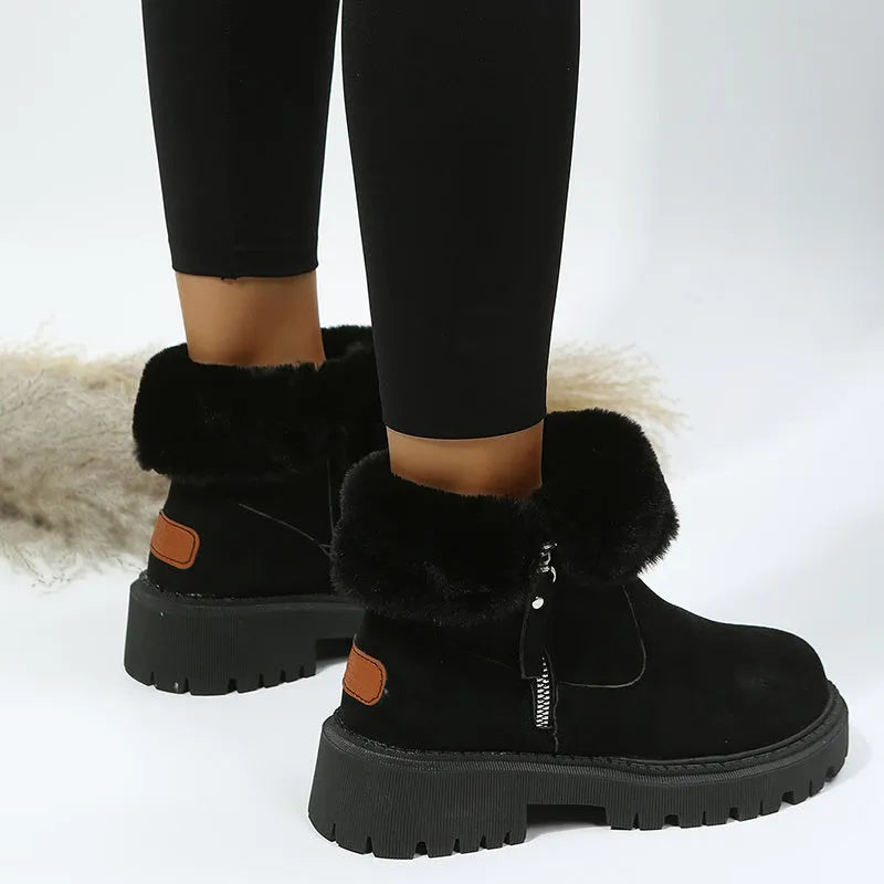 Women's black faux suede high-top snow boot with side zipper on a non-slip rubber sole.