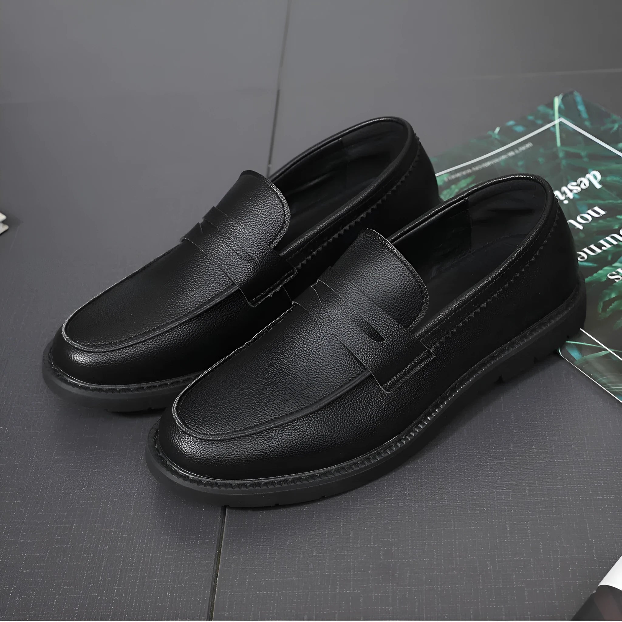 Men's black Korean retro slip-on driving shoes with microfiber upper and stitched detailing on white background