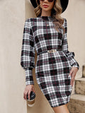 Black tight dress with lantern sleeves and leather stitch detail on a hanger