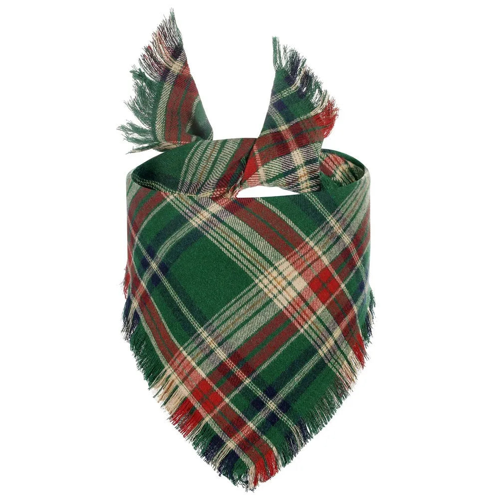 Plaid triangle dog bandana with tassel edges in autumn colours like brown, green, and orange.