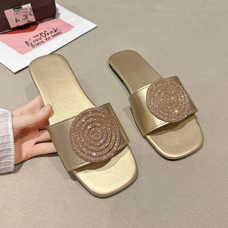 Open toe PU slippers with rhinestone decoration, available in black, white, and gold colours, sizes 36 to 43