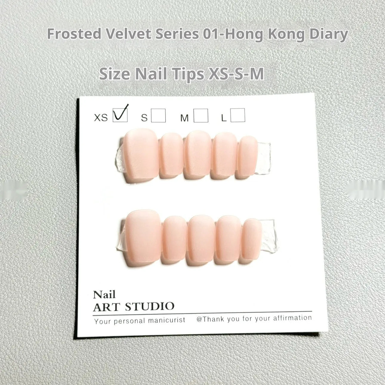 Frosted velvet press-on false nails with electroplated Cat's Eye pattern in short ladder sizes XS, S, and M.