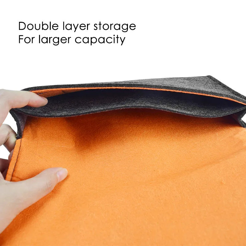 Black felt pouch case for Nintendo Switch console, showing game card slots and double layer storage design.