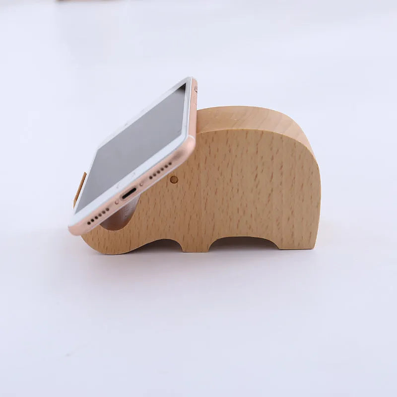 A decorative resin mobile phone stand holding a smartphone, shown in an animal design variant.