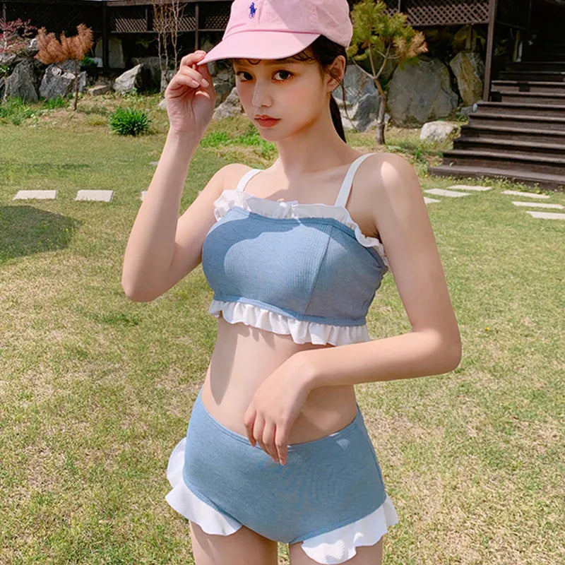 Women's conservative one-piece swimsuit with adjustable suspenders in solid colour