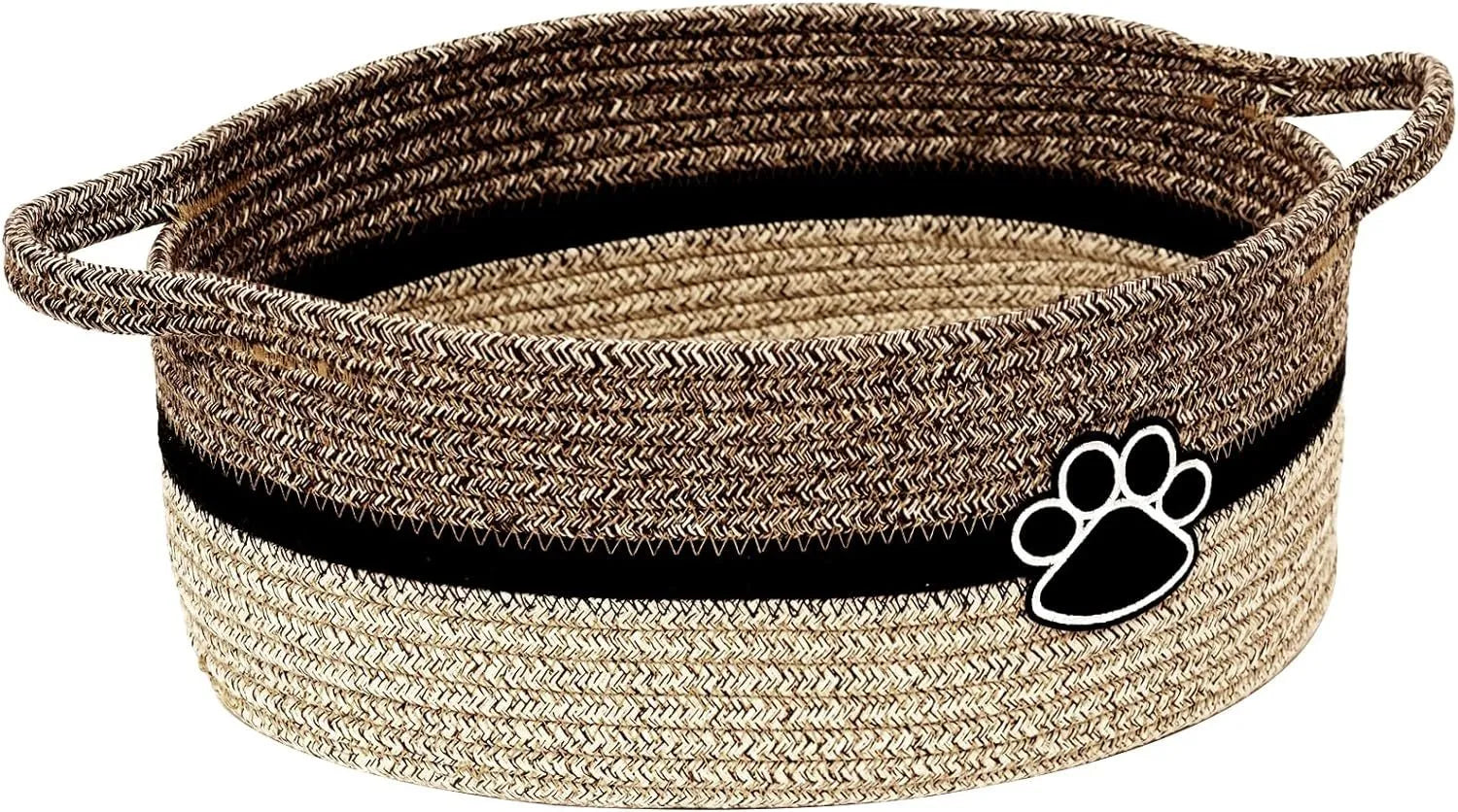 Light beige handmade woven cotton rope storage basket with a wooden handle on a wooden floor.