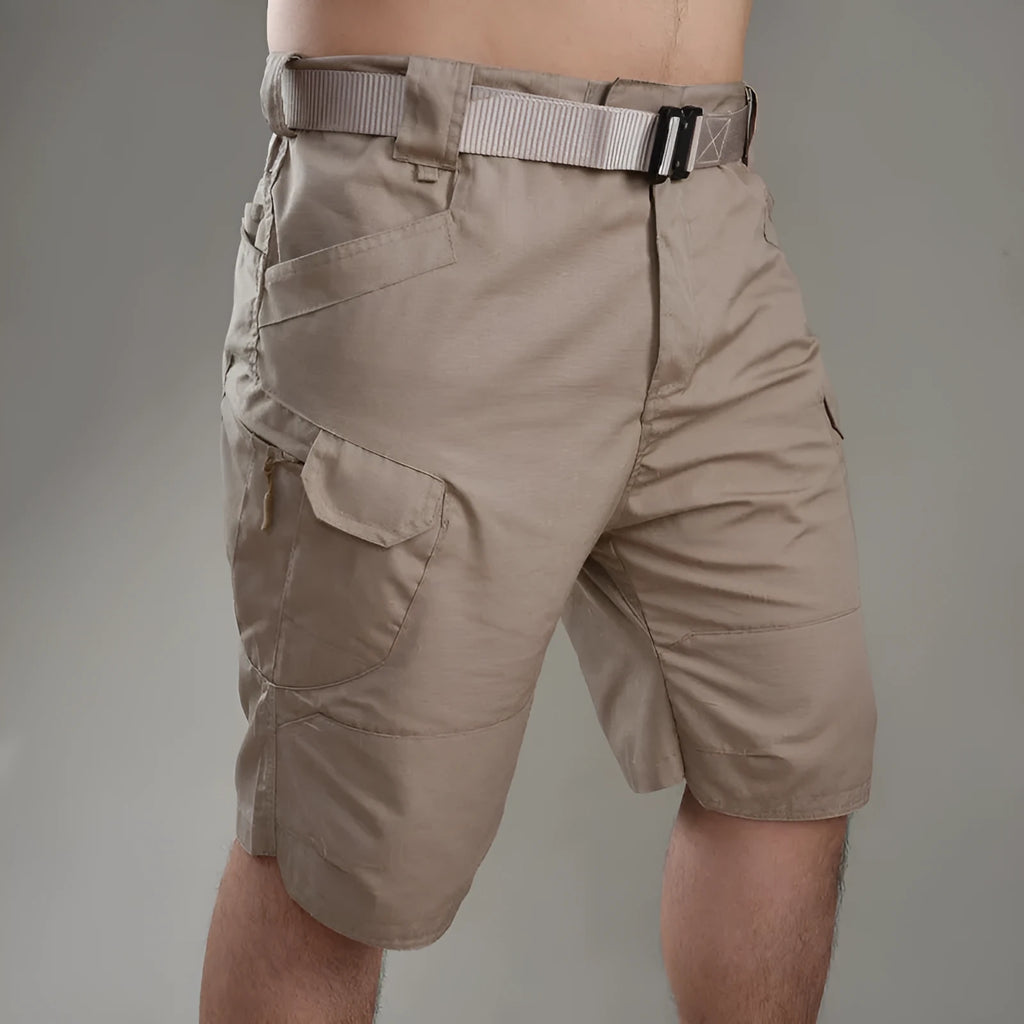 IX7 men's tactical shorts in cotton blend fabric shown in a camouflage colour, featuring a button fly.