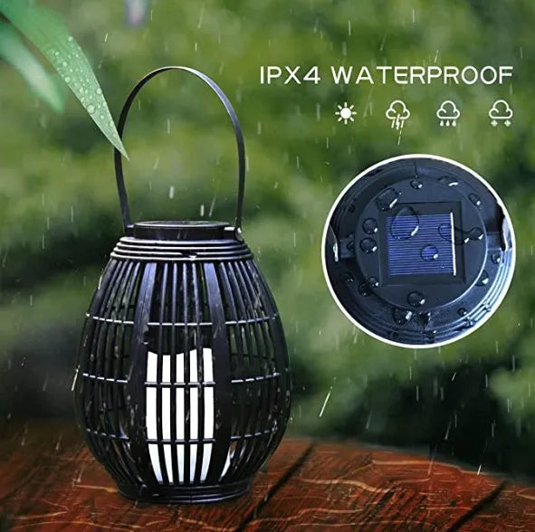 Oval rattan-style solar garden light in retro design for outdoor patio use.