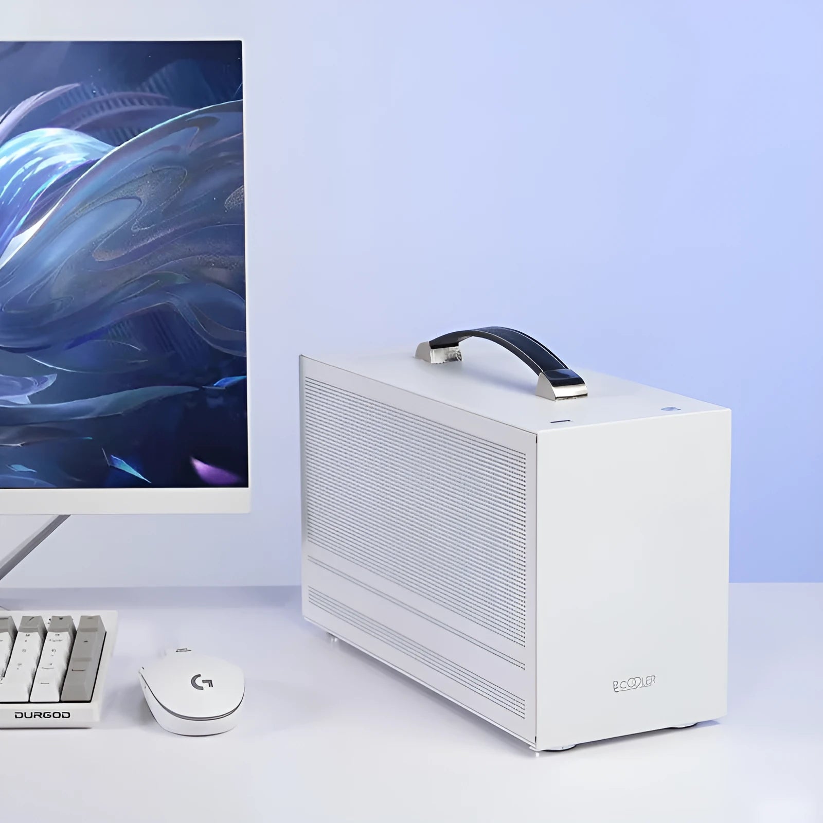 Three Hummingbird Portable compact Mini-ITX desktop computer case in titanium grey showing front panel and side profile.