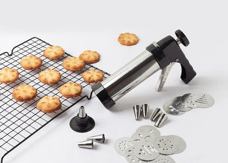 Stainless steel biscuit press gun with 13 cookie moulds and 8 piping nozzles for baking and cake decorating