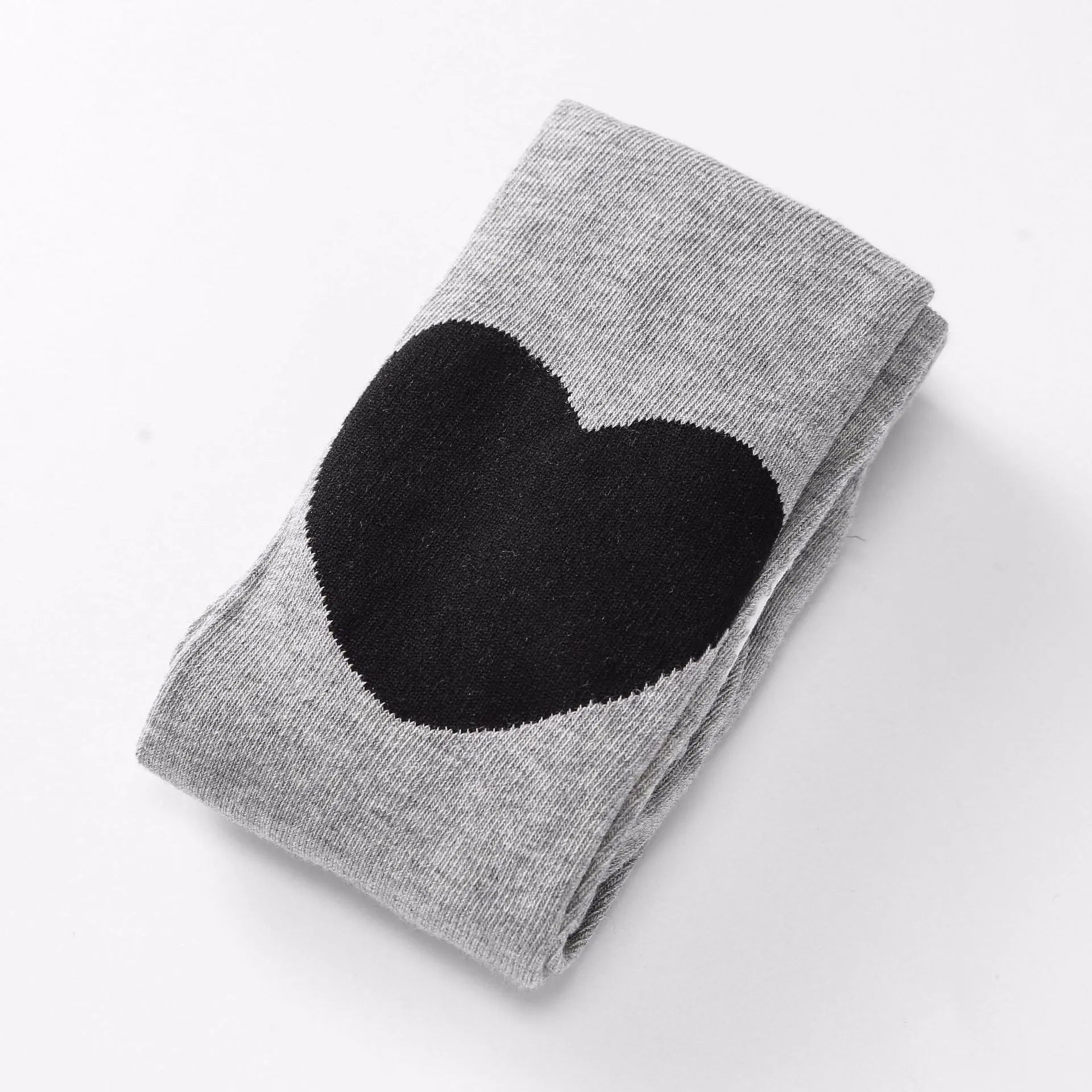 Girl's cotton leggings with five-pointed star and heart patterns in solid colour design