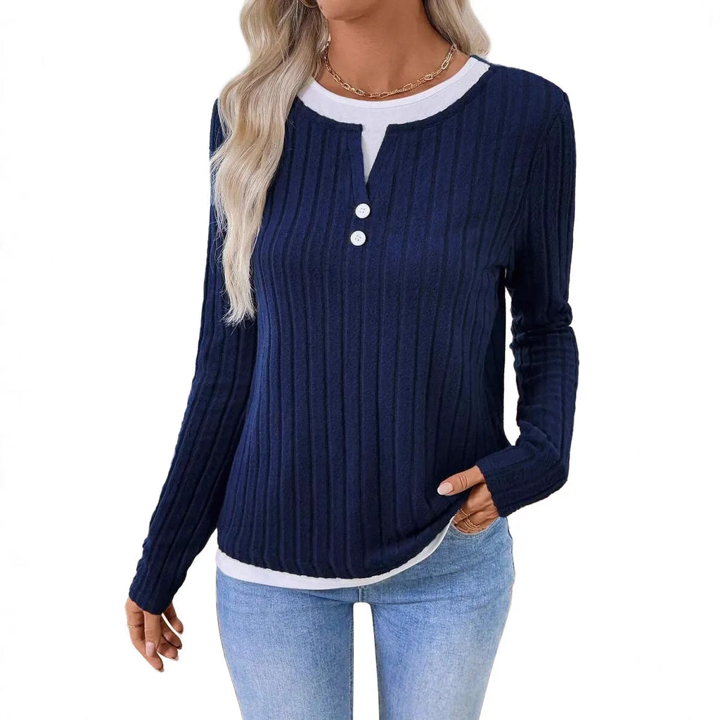 Women's black fake two-piece pullover sweater with round neck, button, and long sleeves on a hanger.