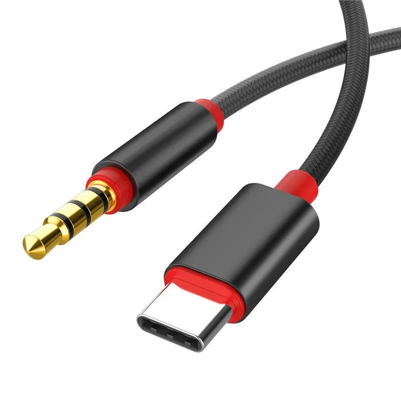 Silver nylon-braided 3.5mm audio cable with connectors on a plain background.