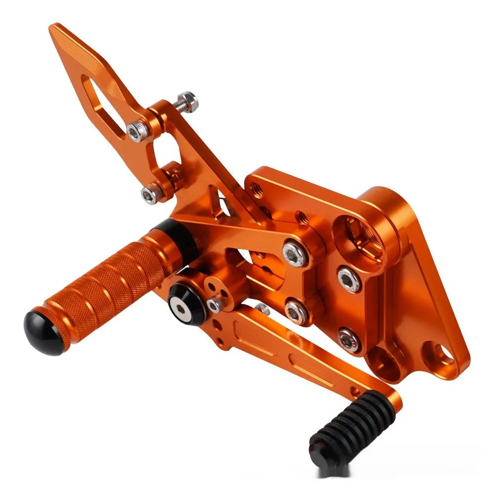 KTM DUKE motorcycle rear pedal support assembly bracket kit in black or orange