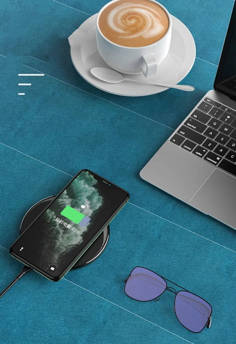 Black Kuulaa KL-CD16 circular wireless charging pad for mobile phones with LED light.