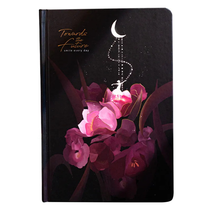 A5 diary book with a luminous purple cover, open to show pages with colour illustrations.