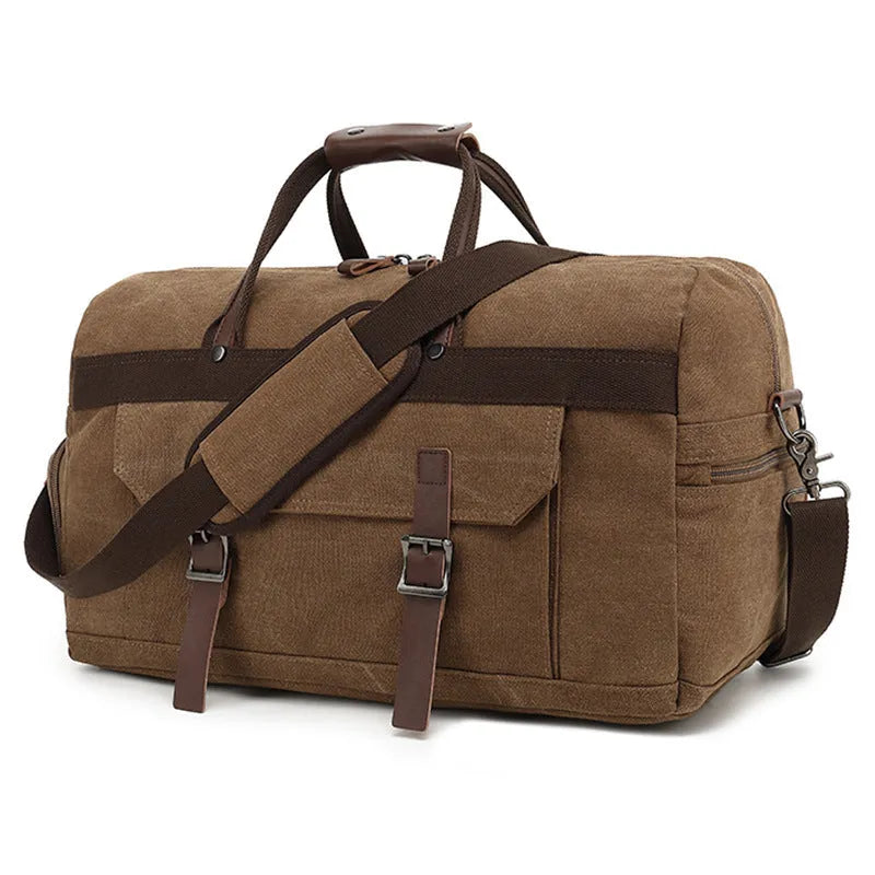 Canvas crossbody travel bag in black with sewing line detailing showing 36-55 litre capacity