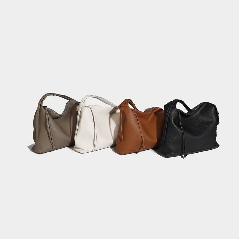 Large capacity caramel coloured underarm shoulder messenger bag made from soft PU material