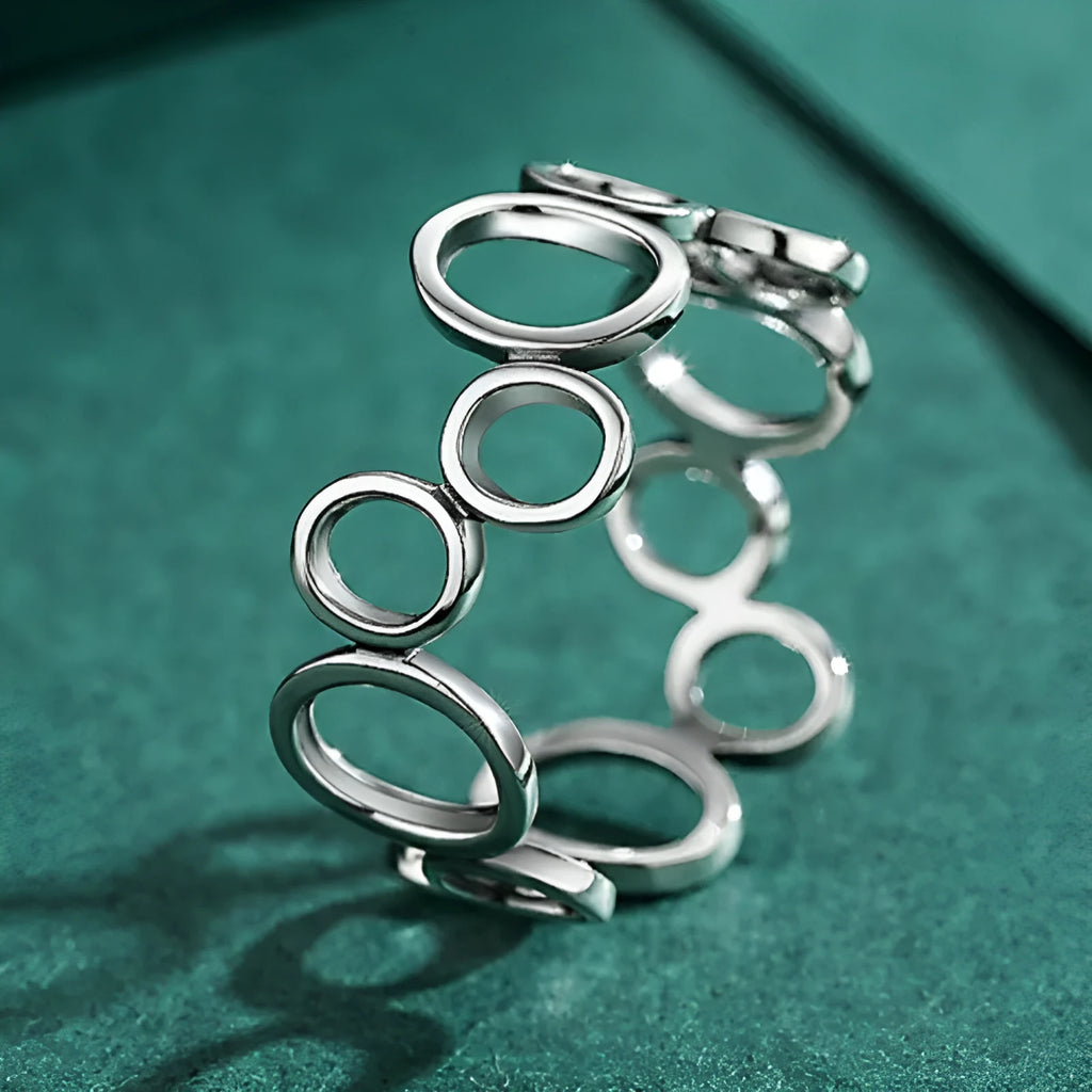 S925 sterling silver geometric circle ring with ellipse motif, women's size US 7 on display