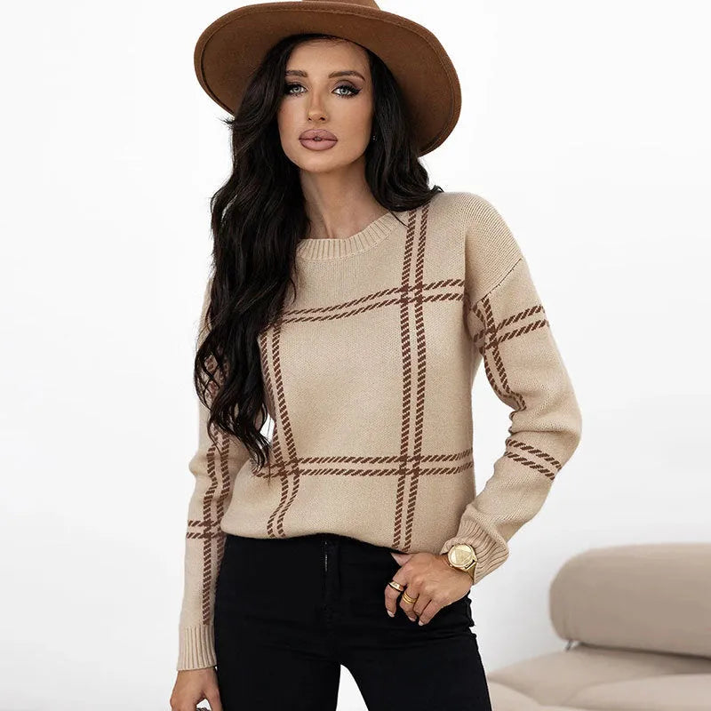 Women's loose fit plaid sweater with apricot, black, beige, red, and green colour-block stripes.