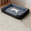 A soft, padded pet sofa mat shown in one of five colours (Black, Grey, Red, Yellow) next to a dog, illustrating its use as a furniture-protecting bed.