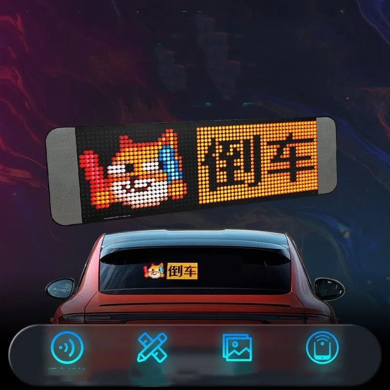 LED message board with full-colour display showing text, with remote control and mobile phone nearby
