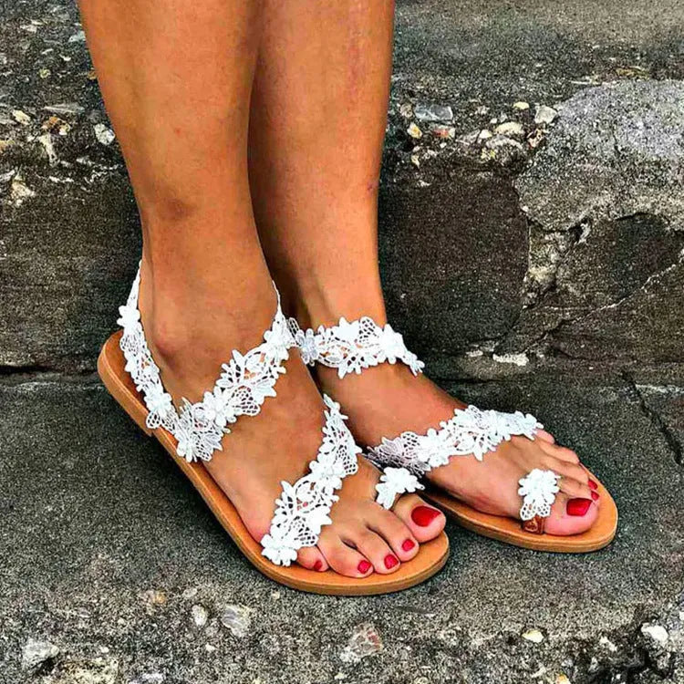 White women's sandals with rhinestone flower decoration and elastic back in sizes 35-43