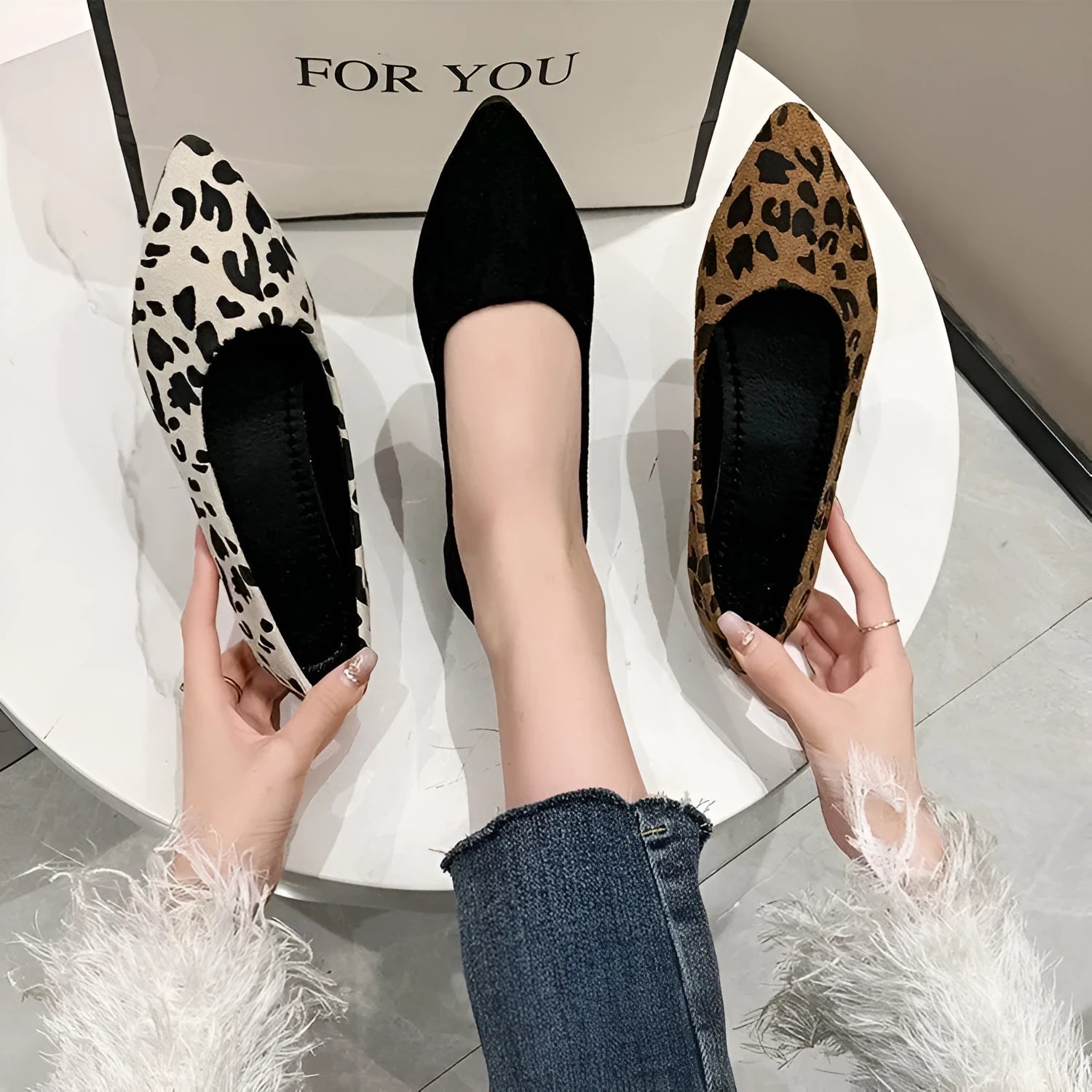 Women's flat pump shoes with a pointed toe in leopard print, beige, and black colour options on a white background.