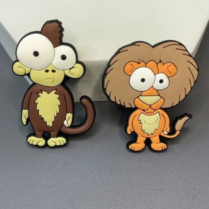 Set of nine PVC cartoon animal refrigerator stickers including monkey, crocodile, leopard, lion, and giraffe in assorted colours