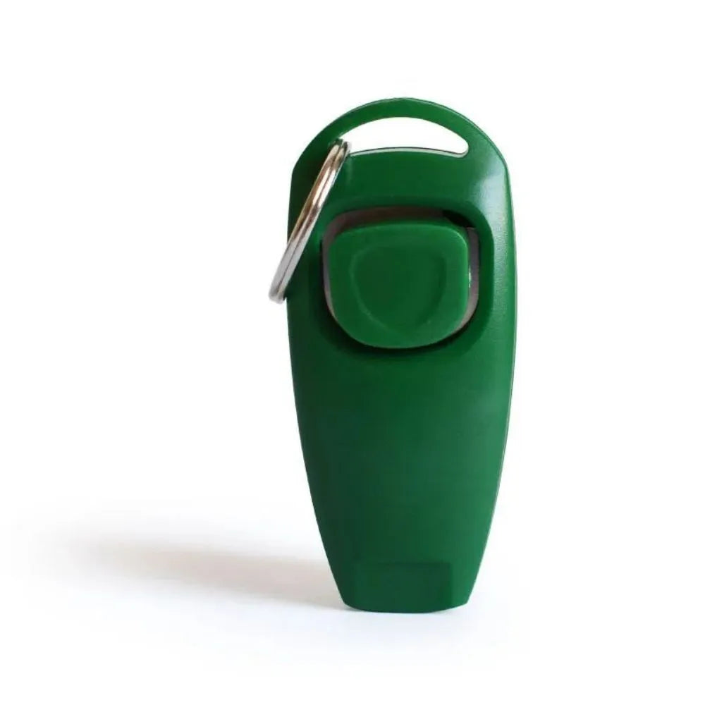 Colourful plastic dog training clicker with whistle and key ring on a white background.