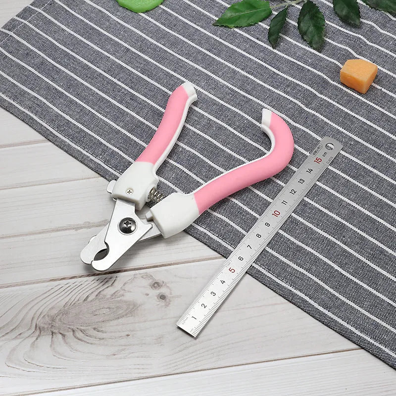 Pet nail scissors with stainless steel cutter head and curved handle in blue or pink, small or large size