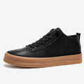 Men's black casual leather shoes with a round toe, lace-up front, and flat rubber sole.
